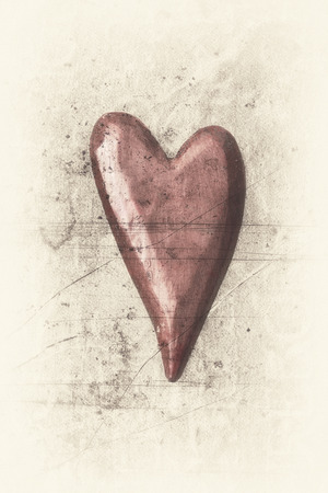 Soft smooth red heart on a bright beige background textured with dark stains and scratches.の写真素材