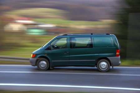 Speedy green van on the roadの写真素材