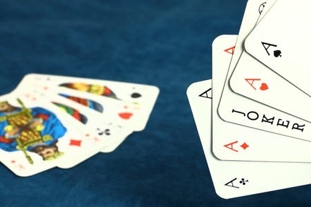 	Playing hazard game by poker cards on dark blue backgroundのeditorial素材