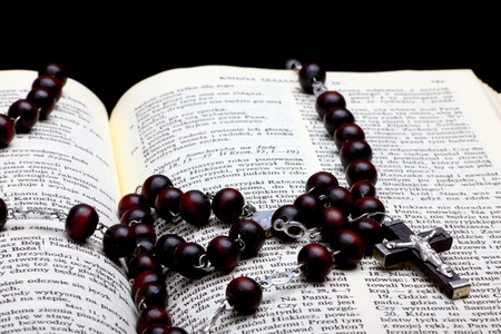 Christian Holy Bible with Cross on rosaryの写真素材