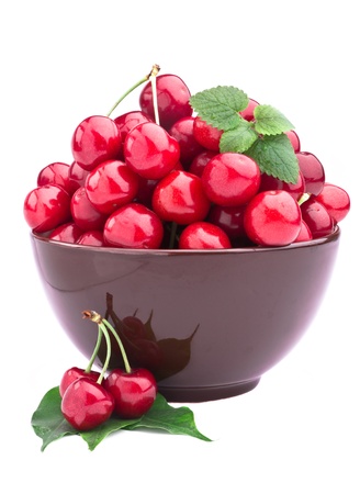 Sweet cherry fruits in brown bowlの写真素材