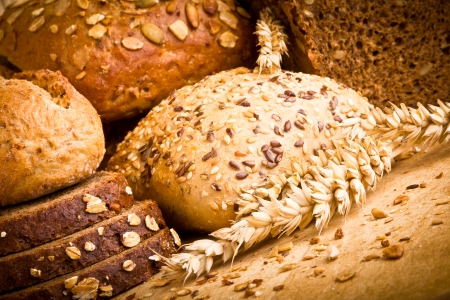 Collection of baked bread on wooden backgroundの写真素材