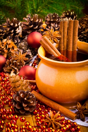 Mulled wine in brown jug with cinnamon and aniseの写真素材