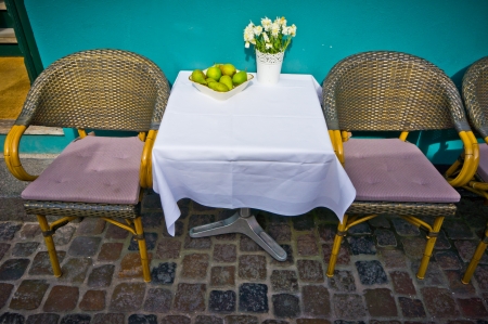 Vintage old fashioned cafe chairs with table in Copenhagen, Denmarkの写真素材