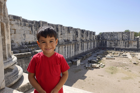 Portrait of smiling boy in the temple of Apollo.の写真素材