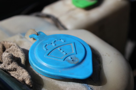 The lid of the washer fluid reservoir from the engine of a carの写真素材