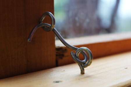 The hook - latch for a window in the houseの写真素材