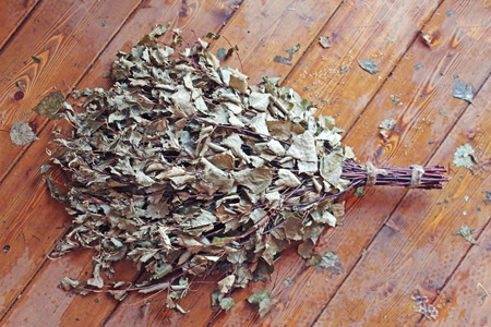 Bath broom on a wooden backgroundの写真素材