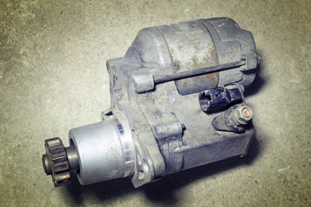 Automotive starter on a gray backgroundの写真素材