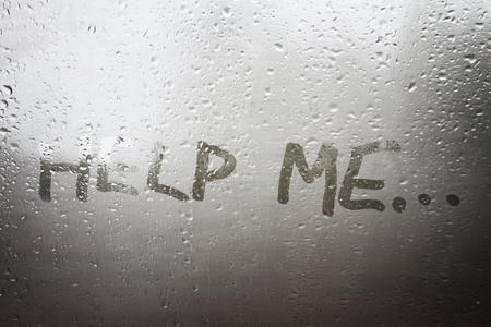 The "Help Me" inscription on the sweaty glassの写真素材