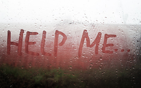The "Help Me" inscription on the sweaty glassの写真素材