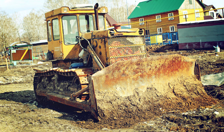 Old abandoned excavator in the countryside