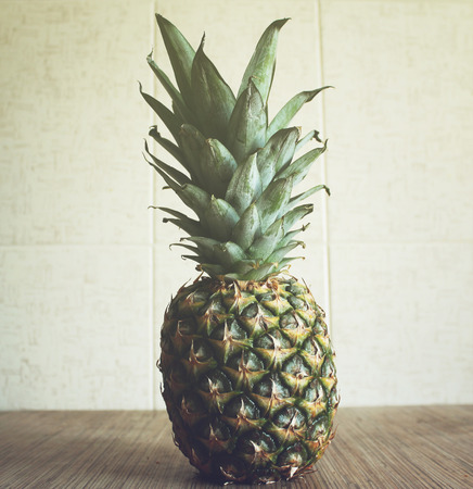 Fresh ripe pineapple on the tableの写真素材