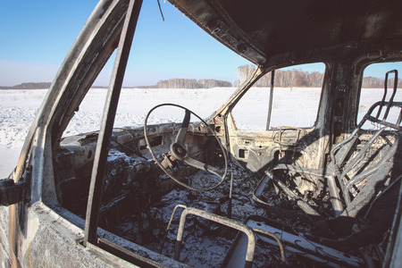 Burnt car in the winterの写真素材