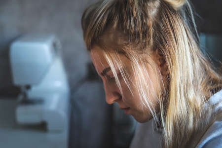 The seamstress at work in the studioの写真素材