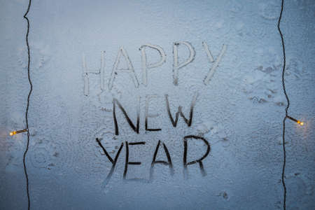 Inscription - Happy New Year on a frosty windowの写真素材