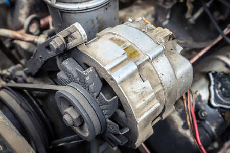 Old car generator close-up. engine partsの写真素材