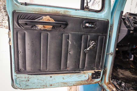 Door panel of an old truck with defect close-upの写真素材