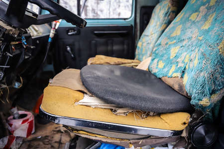 Interior of an old truck with a broken seatの写真素材