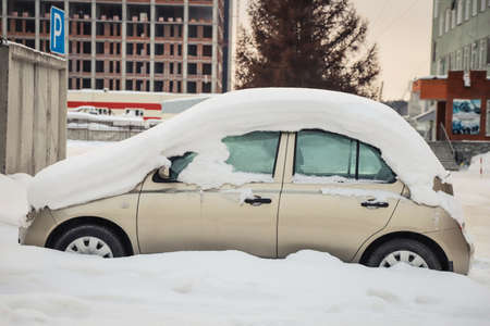 Snowdrift on a car in winter. Season specific. Outdoorsの写真素材