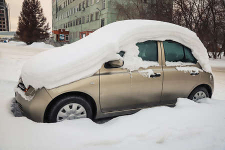 Snowdrift on a car in winter. Season specific. Outdoorsの写真素材