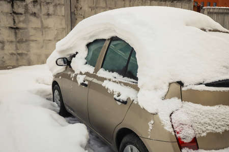 Snowdrift on a car in winter. Season specific. Outdoorsの写真素材