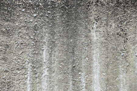Old gray concrete wall close-up - texture. industrial backgroundの写真素材