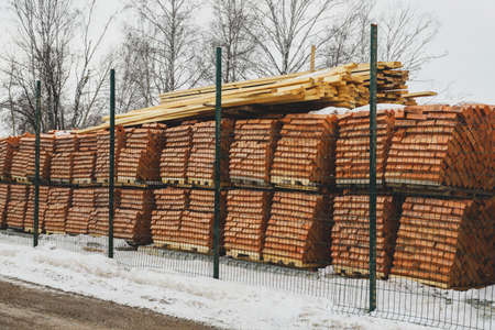 Pallets of bricks for construction. outdoor storage in winter. Warehousing of large quantities of unitsの写真素材