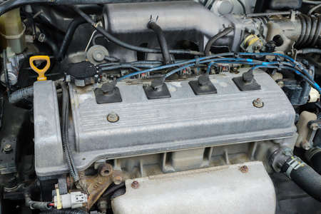 Old dirty engine under the hood of a carの写真素材