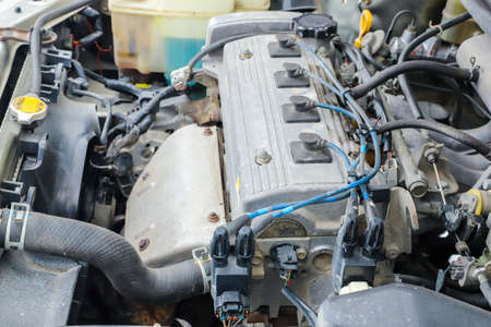 Old dirty engine under the hood of a carの写真素材