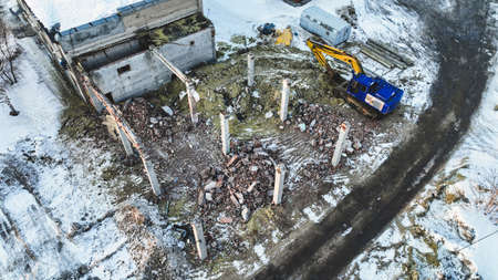 Demolition of an old building in winter. Fragments of brick. industrial backgroundの写真素材