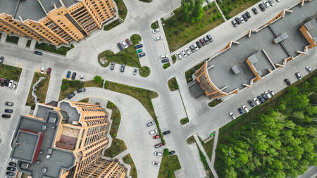 Parking in the courtyard of high-rise buildings in summer. air viewの写真素材