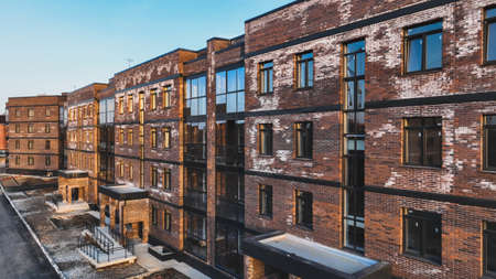 A new brick house stained with white efflorescence, a crystalline of salt, formed due to water being present in the bricks. construction defectsの写真素材