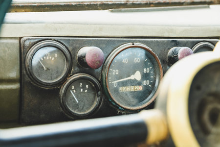 The dashboard in an old car close-up. Speedometer and gaugesの写真素材