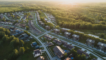 Small modern village in summer at sunset. Aerial viewの写真素材