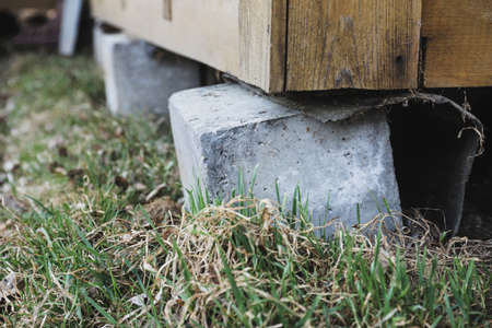 Rickety concrete support of a country house close-up. selective focusの写真素材