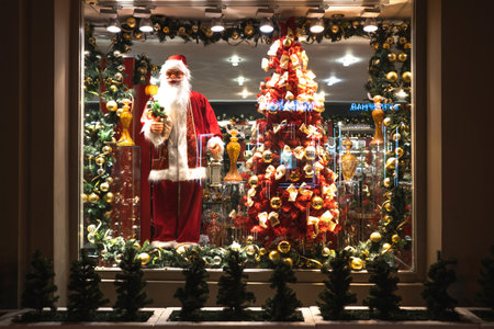 Christmas shop window with Santa Claus and Christmas treeの写真素材