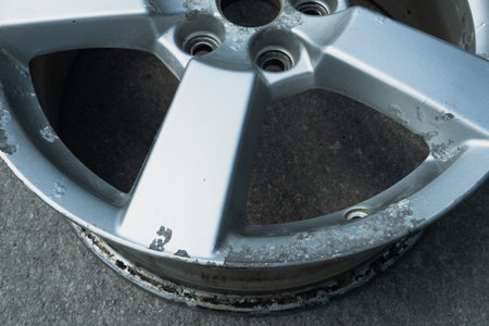 Corrosion on a silver aluminum alloy wheel close-upの写真素材