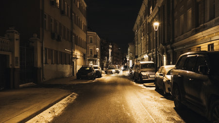 Dark street in the city at night in winterの写真素材