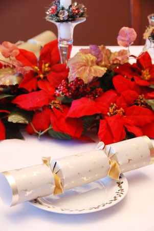 Christmas party cracker on a decorated tableの写真素材