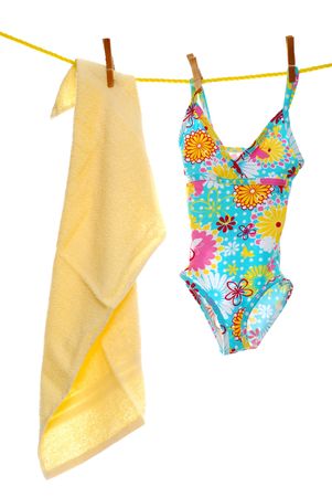 Child's bathing suit beach towel on clothes lineの写真素材