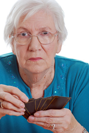  Senior woman holding playing cardsのeditorial素材