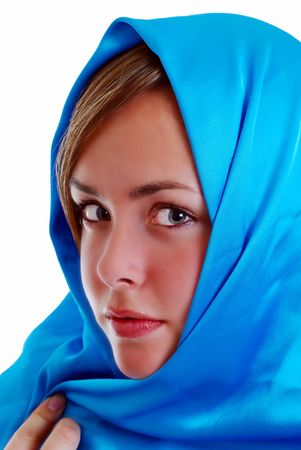 young girl wrapped in a blue scarfの写真素材