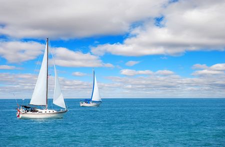 sail boating on blue waterの写真素材