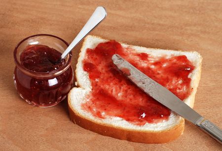 bread and jam with knifeの写真素材