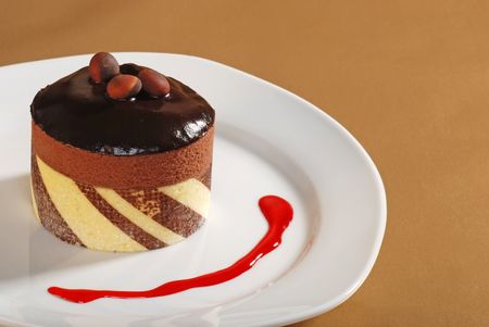 Chocolate Truffle cake with nuts and raspberry sauceの写真素材