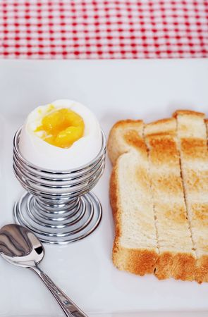 closeup soft boiled egg with sliced toastの写真素材
