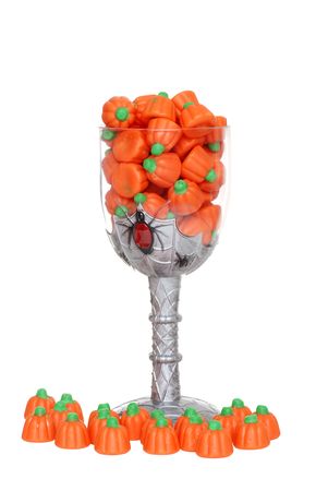 glass filled with pumpkin candyの写真素材