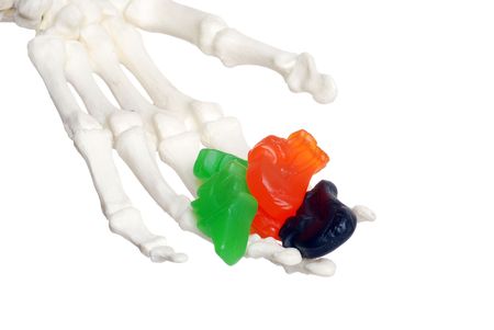 skeleton hand offering candy