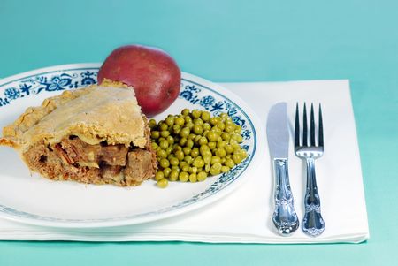 Steak and mushroom meat pie with vegetablesの写真素材